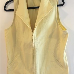 Cute yellow zip up vest.